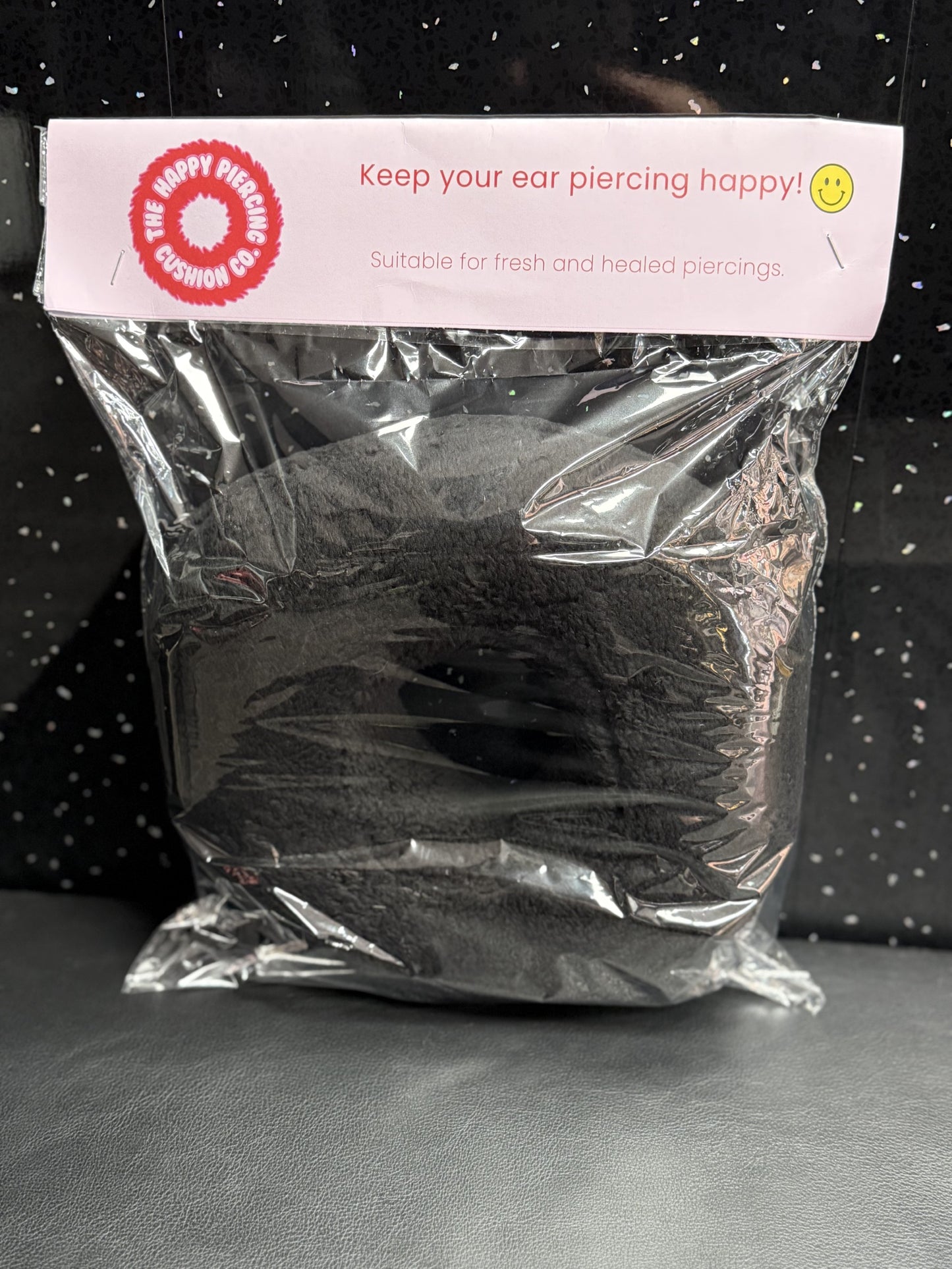 The Happy Piercing cushion