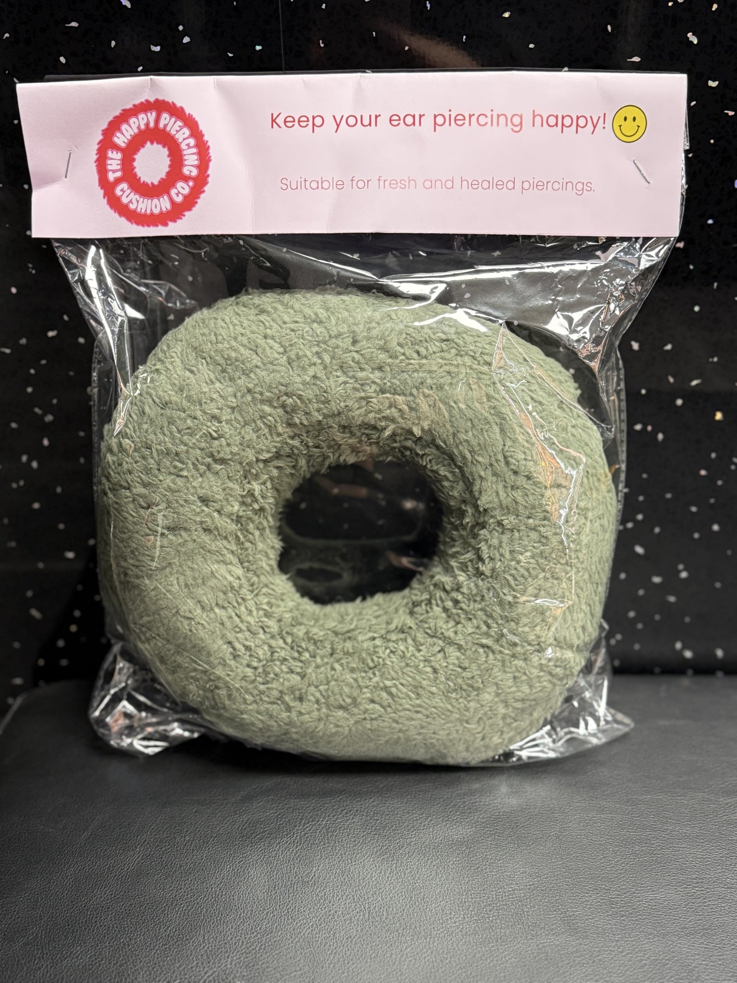 The Happy Piercing cushion