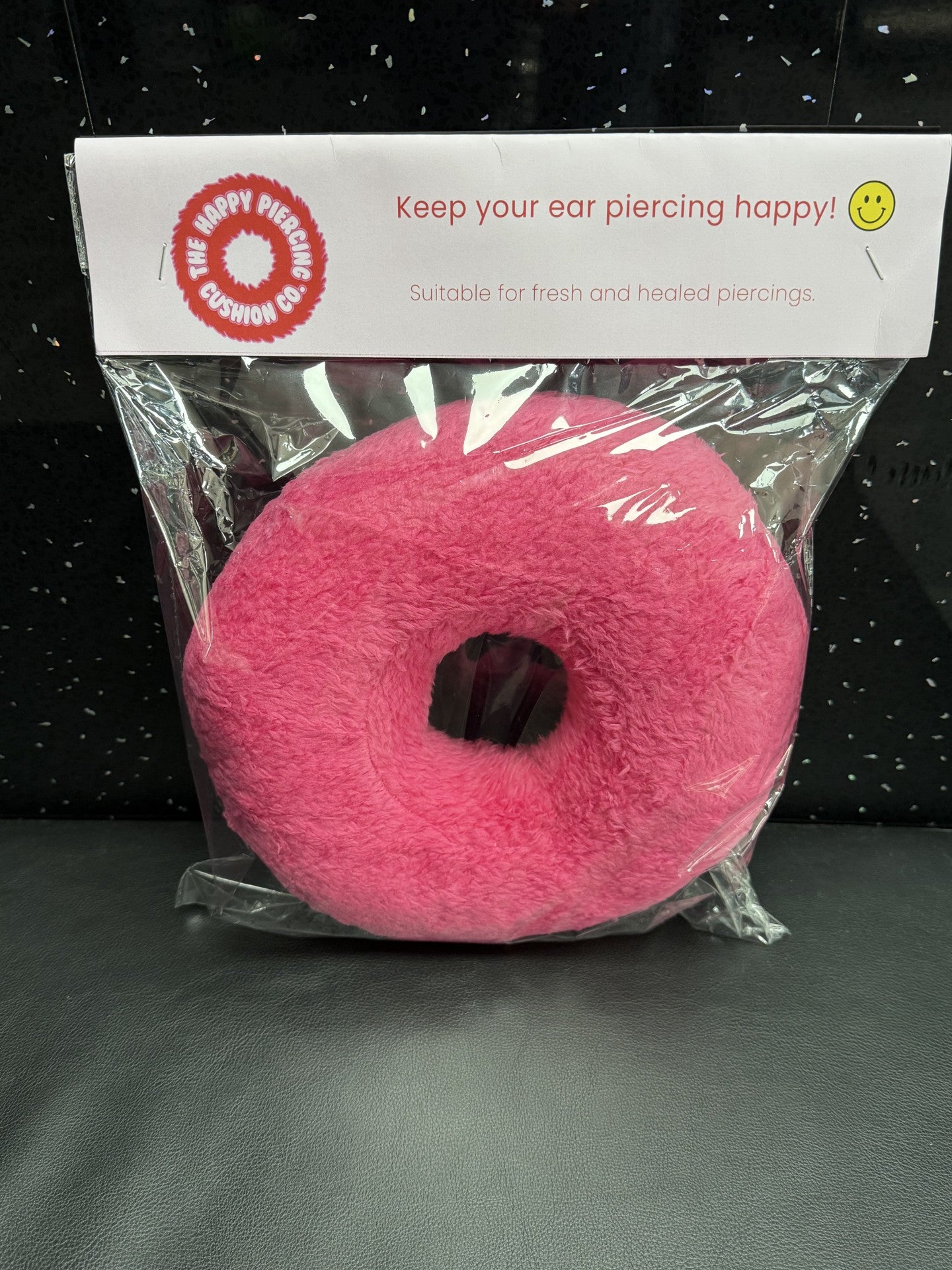 The Happy Piercing cushion