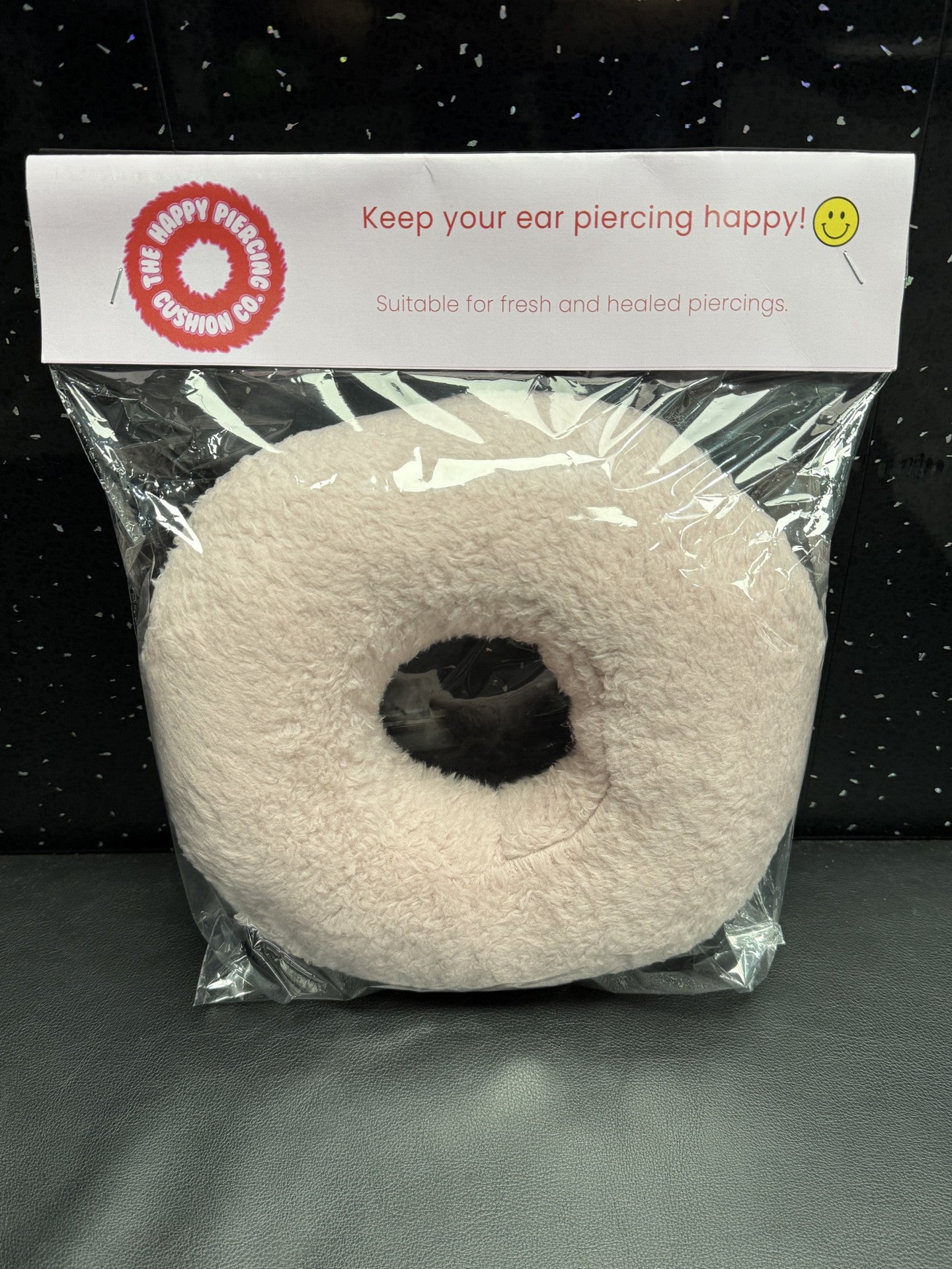 The Happy Piercing cushion