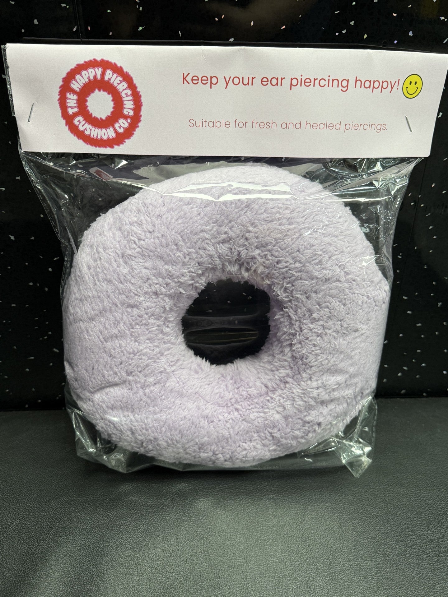 The Happy Piercing cushion