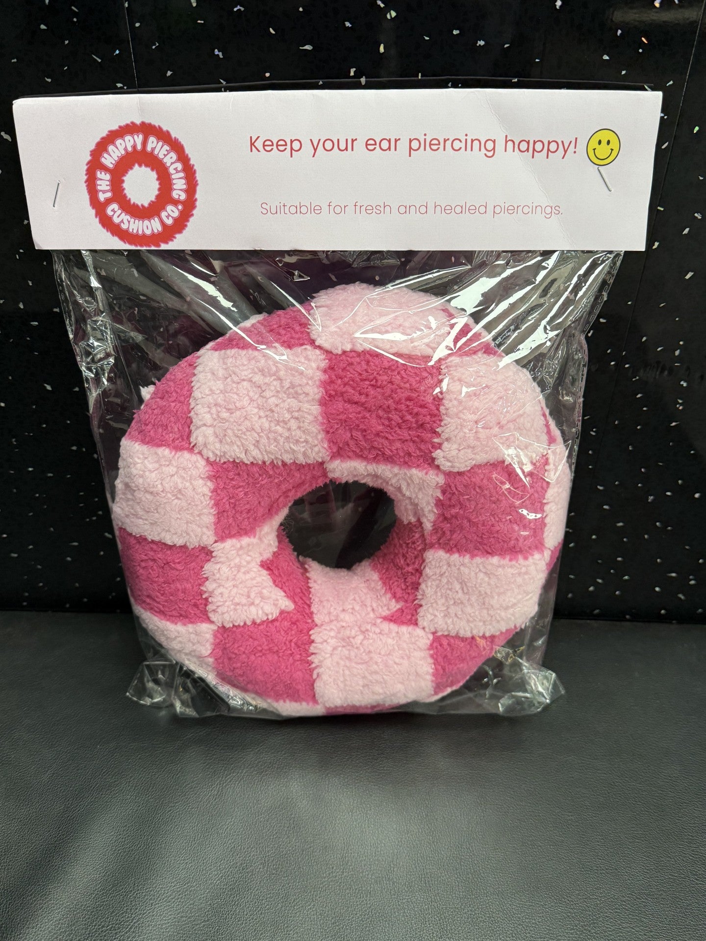 The Happy Piercing cushion