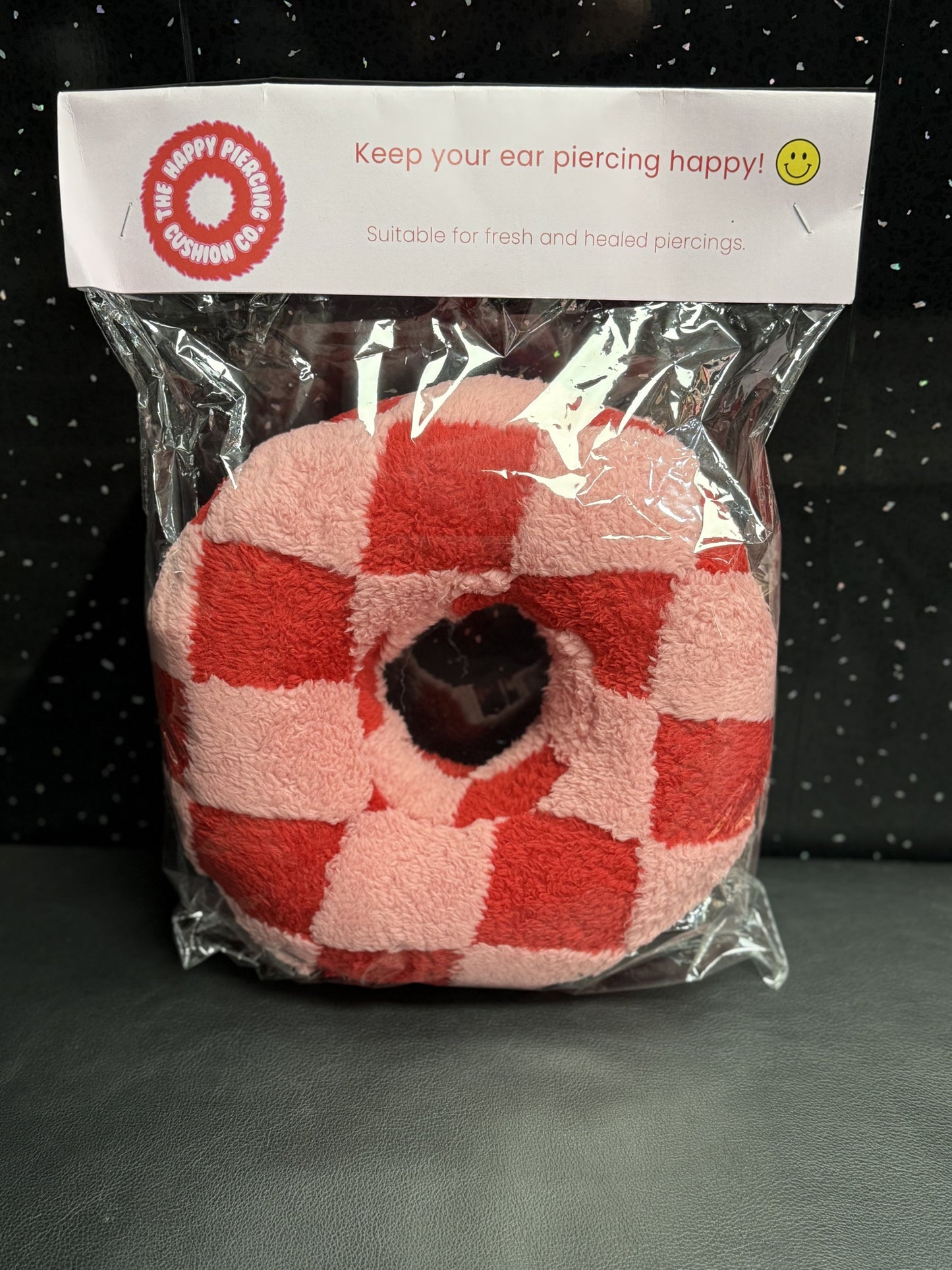 The Happy Piercing cushion